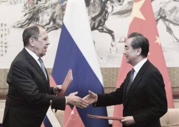 Russia's Foreign Minister Sergei Lavrov (left) and Chinese State Councilor and Foreign Minister Wang Yi (right) shake hands right after their signing at the Diaoyutai State Guest House in Beijing, China, on April 23, 2018. (Kyodo News/ Madoka Ikegami, Pool)
