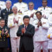 Chinese Communist Party leader Xi Jinping (center) and Chinese and foreign naval officials applaud after a group photo during an event to commemorate the 70th anniversary of the People's Liberation Army (PLA) Navy in Qingdao, in eastern China's Shandong province, on April 23, 2019. (Mark Schiefelbein/AFP via Getty Images)