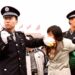 Two Chinese police officers arrest a Falun Gong practitioner at Tiananmen Square in Beijing on Jan. 10, 2000. (Chien-Min Chung/AP Photo)