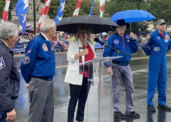 Veteran astronauts of the Apollo Program, joined by Artemis II's Randy Bresnik, are introduced at the National Memorial Day Parade on May 29, 2023. (Joseph Lord/The Epoch Times)
