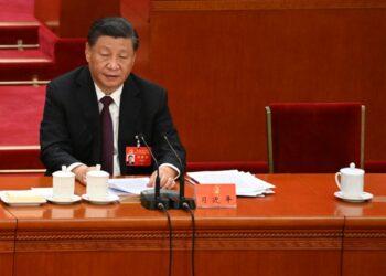 China's President Xi Jinping sits beside the empty seat of former president Hu Jintao during the closing ceremony of the 20th Chinese Communist Party's Congress at the Great Hall of the People in Beijing on Oct. 22, 2022.( Noel Celis/AFP via Getty Images)