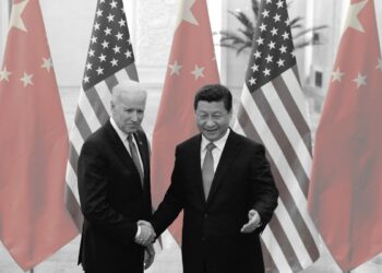 Chinese leader Xi Jinping shakes hands with then-U.S. Vice President Joe Biden inside the Great Hall of the People in Beijing on Dec. 4, 2013. (Lintao Zhang/Getty Images)