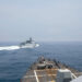 The Arleigh Burke-class guided-missile destroyer USS Chung-Hoon is observing the Chinese PLA Navy vessel Luyang III (top) while on a transit through the Taiwan Strait with the Royal Canadian Navy's HMCS Montreal on June 3, 2023. (Andre T. Richard/U.S. Navy/AFP/Getty Images)