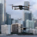 A DJI Mavic 2 Pro and DJI Mavic Mini made by the Chinese drone maker fly near each other in Miami, Florida, on Dec. 15, 2021. (Joe Raedle/Getty Images)