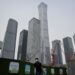 A man walks past the Central Business District in Beijing on May 31, 2023. (Jade Gao/AFP via Getty Images)